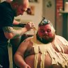 an-obese-man-getting-a-hair-cut-while-bathing-in-mayo-bing-v0-sfnc2jlbf31b1.jpg